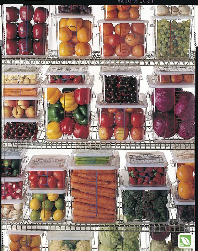Clear stackable refrigerator organizer containers storing fresh fruits vegetables and produce for kitchen organization