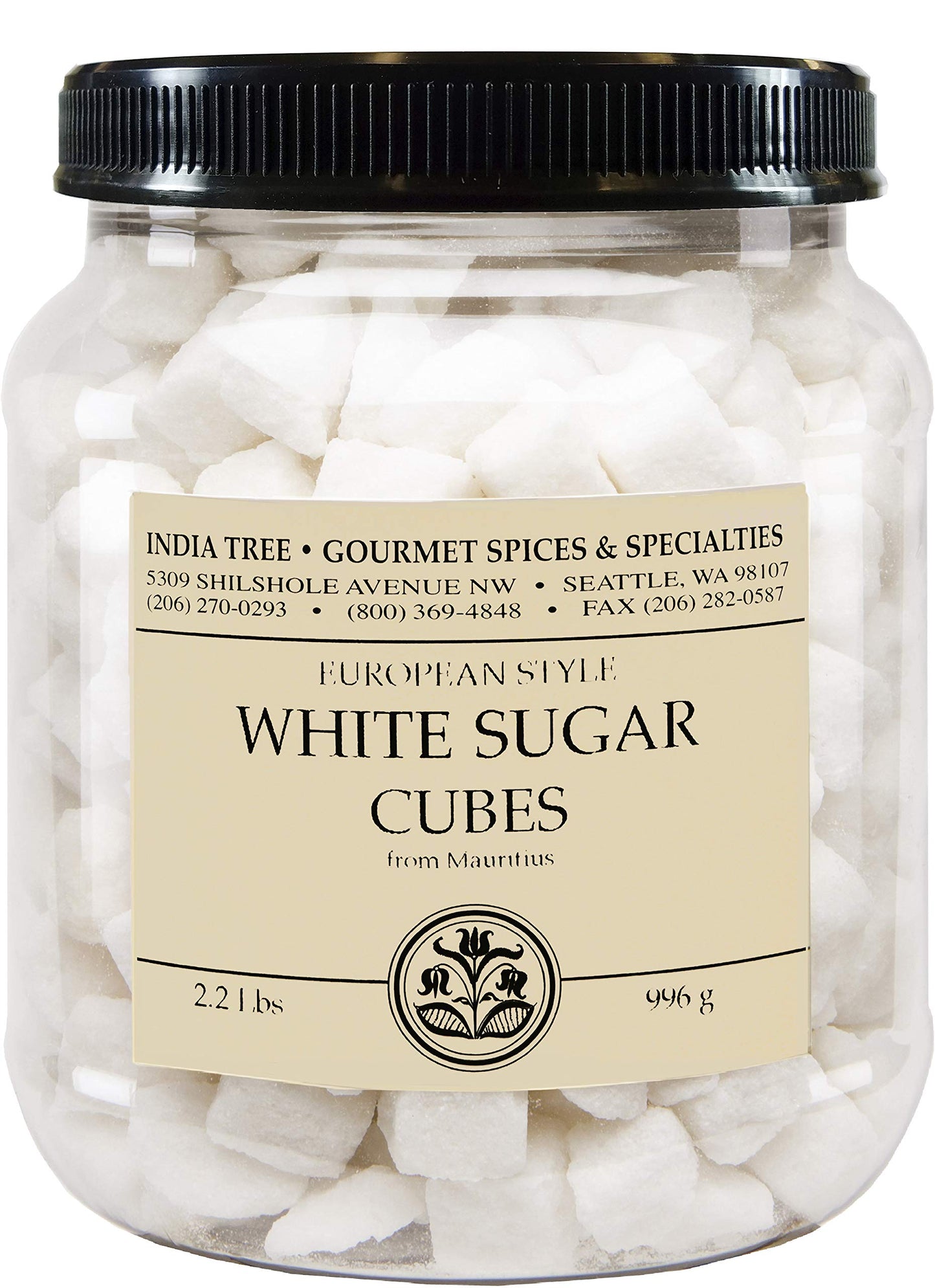 A clear plastic jar filled with white sugar cubes, topped with a black ribbed lid and a cream-colored label reading 'White Sugar Cubes' with the brand 'India Tree Gourmet Spices & Specialties'.